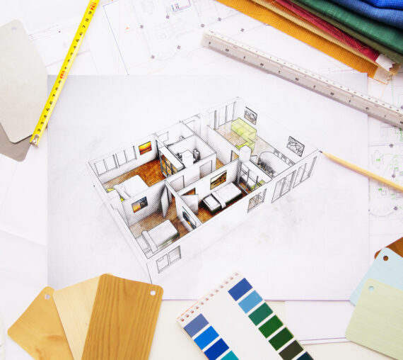 Top view of interior designer desktop workspace project surrounded by tools and materials
